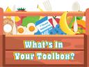 Wooden toolbox of foods (banana, milk "1% Reduced Fat", eggs, bagel) with text "What's In Your Toolbox?"
