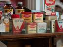 Shelf of vintage spice tins including Sauer's Paprika and Durkee ground Nutmeg