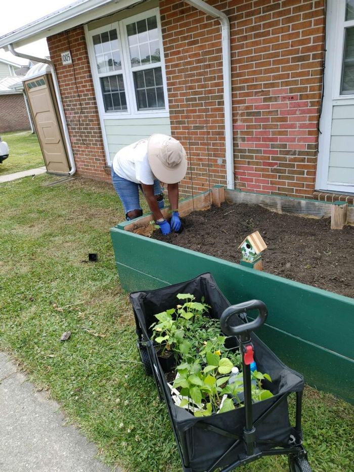 Sonya working a neighbors garden