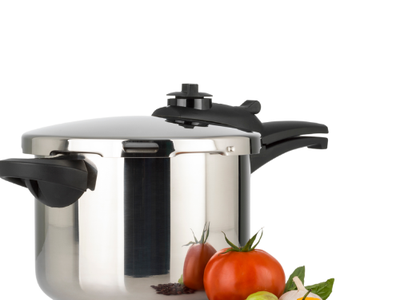 a pressure canner with tomato peppers and beans