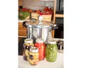 canner with canned foods in front it