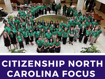 Large group in green shirts around an atrium fountain; text "CITIZENSHIP NORTH CAROLINA FOCUS".