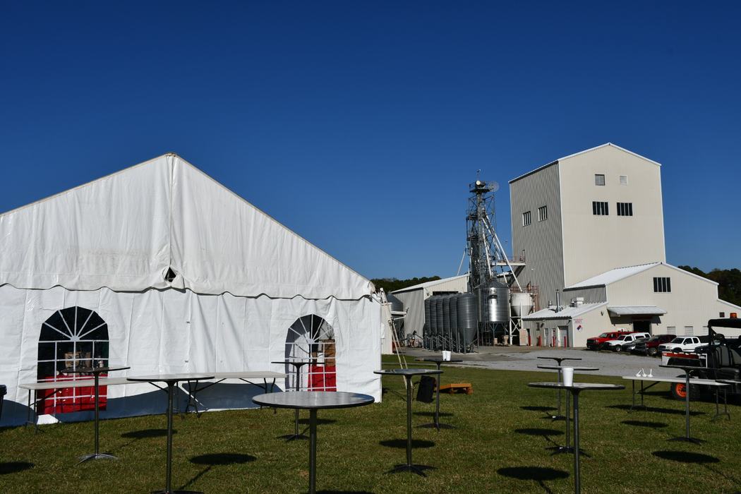 tent in front of feed mill education unit