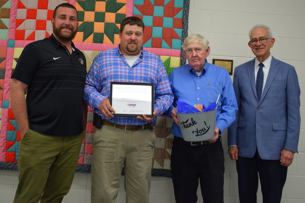 Commercial Horticulture Volunteer Award Recipient, Neil Westmoreland, with Commercial Horticulture Agent, Taylor Darnell, and Forsyth County Commissioners Richard Linville and Dr. Don Martin