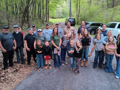 Members of the Livestock 4-H Club pose with other community members after a farm tour during their April 2023 meeting.