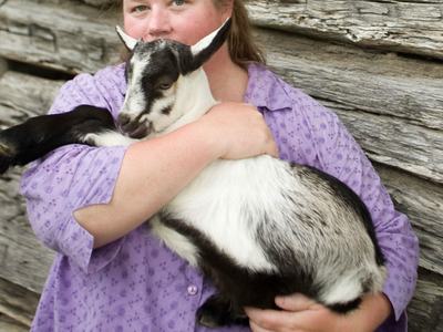 Debbie Roos with a goat.