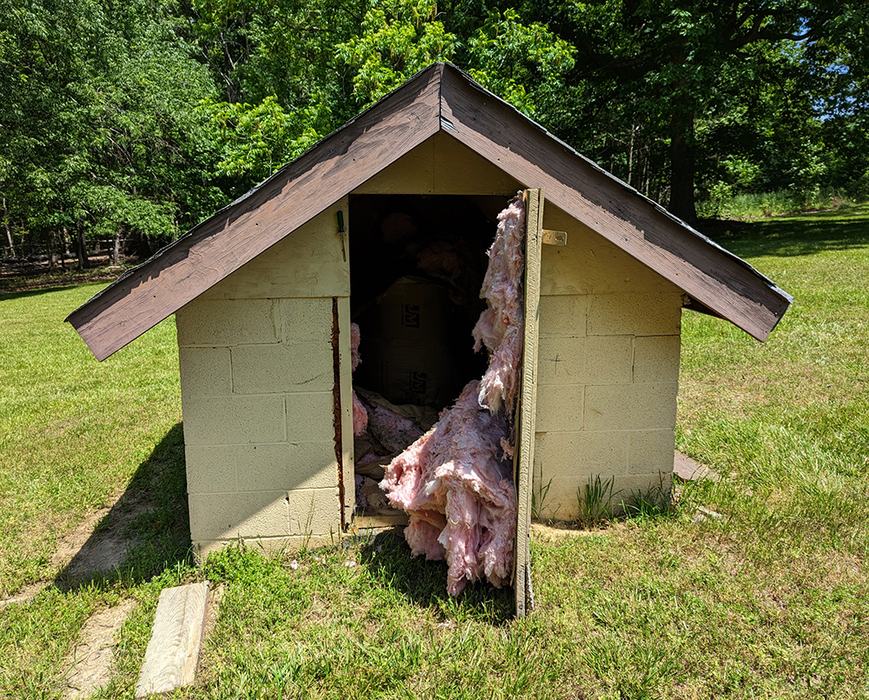 Well house where bumble bees made a nest. 