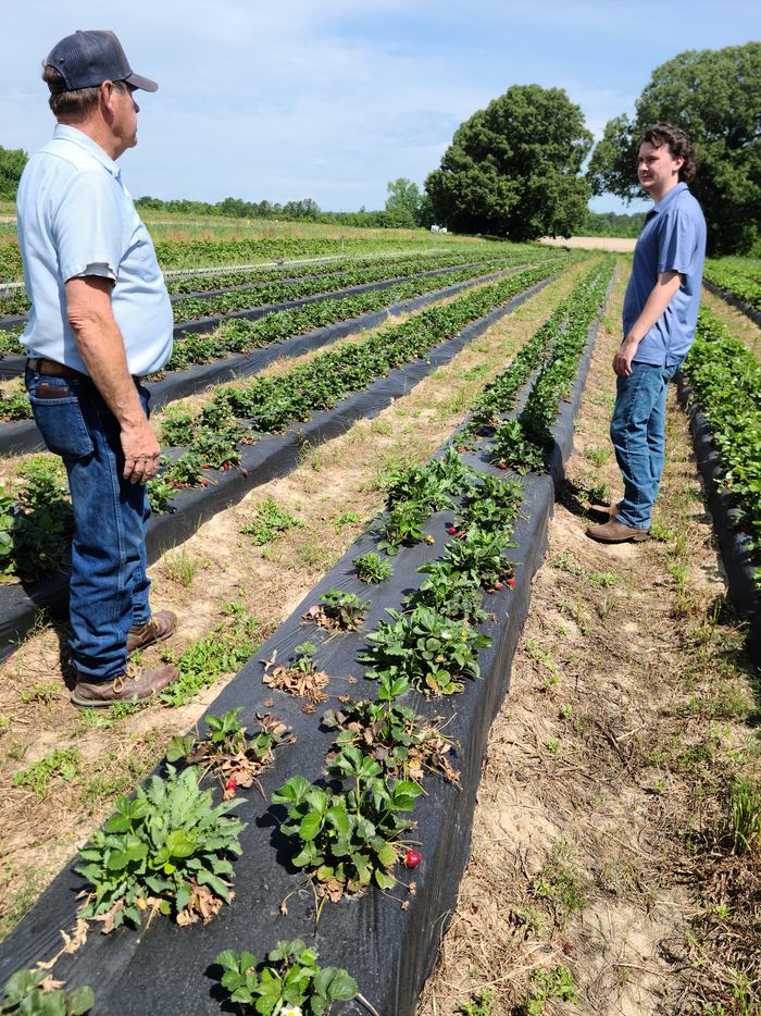 Jared Butler and Steve McNeill in the field