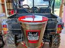 UTV rear with mounted Herd Sure-Feed Broadcaster labeled "Herd SURE-FEED BROADCASTER"