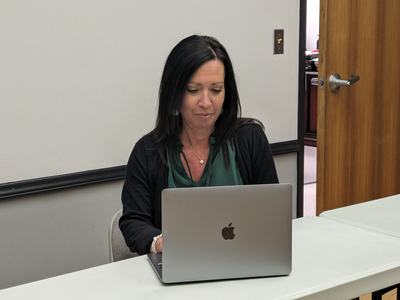 Heather at a computer