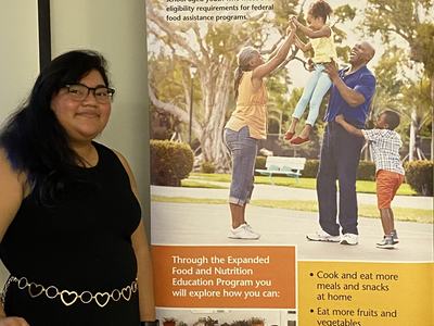 Sthefany with EFNEP poster