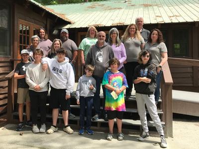 group standing in front of the dining hall at Millstone 4-H camp