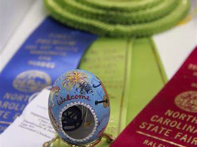 Egg that has blue paint and detailed design on it. Submitted to the state fair.