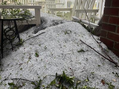 Hail falling from a roof line in Pitt County, NC.