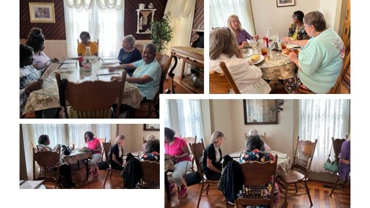 A group of adults have lunch at a restaurant.