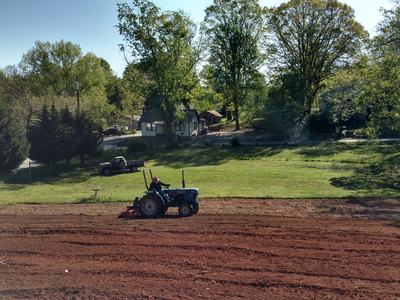 farmer plowing field