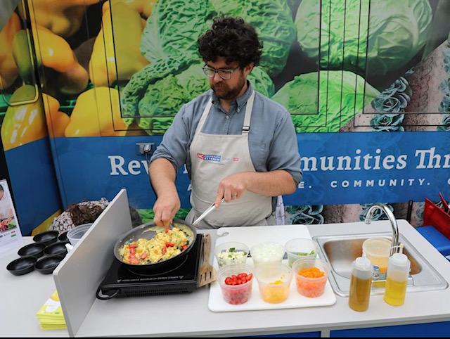 Zac Hackney cooking vegetables