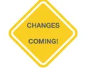 Yellow diamond sign with gray text "CHANGES COMING!"