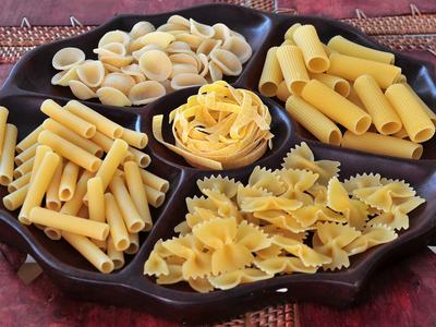 Various type os pasta displayed on a serving tray.