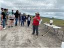 Man explaining fertilizer research to students in a field; overlaid text: "optimal rate of fertilizers"