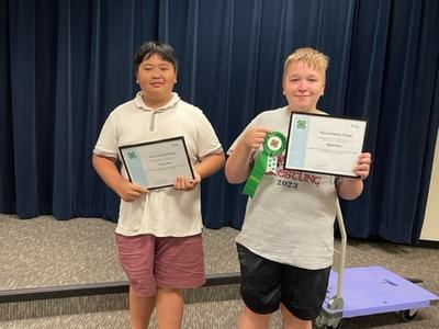Thang Pham and Eli Dillion pose proudly with their awards from NC 4-H Electric Congress.