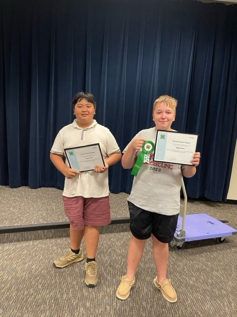 Thang Pham and Eli Dillion pose proudly with their awards from NC 4-H Electric Congress.