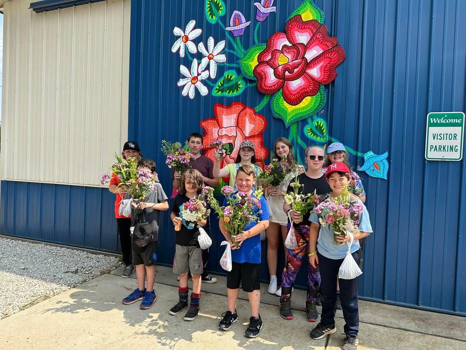 Our group holding their flower arrangements from Hawk and Sparrow Flower Farm