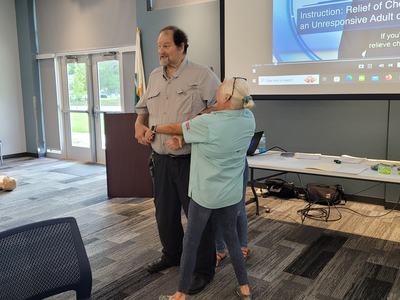 Two adults discuss resuscitation techniques