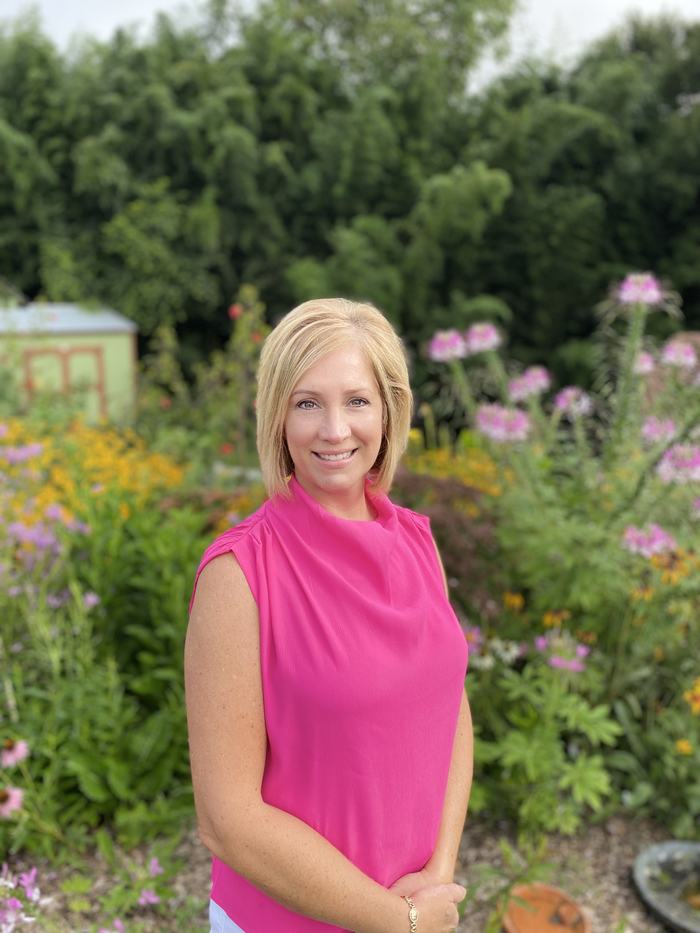 Woman in a butterfly garden.