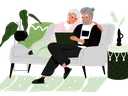 Older man and woman sitting on couch reviewing disaster plans on the computer.