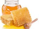 Jar of honey with honeycomb
