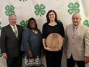 Amy Lucas poses with award