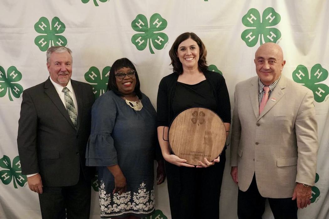 Amy Lucas poses with award