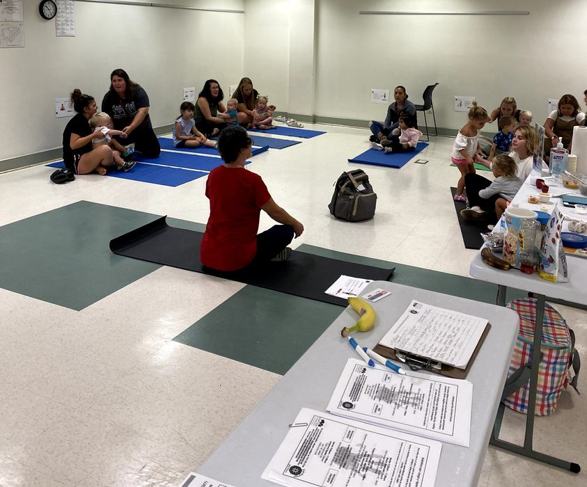 families stretching on yoga mats