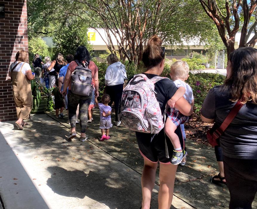 families exploring botanical gardens
