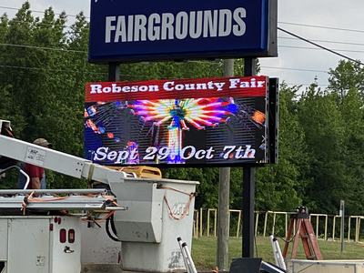 Robeson County Fairgrounds sign with LED reading "Robeson County Fair Sept 29 - Oct 7th"