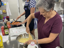 Picture of Stephanie Stevenson, FCS Agent, in the kitchen helping a participant with Cook Smart, Eat Smart program in Jones County.