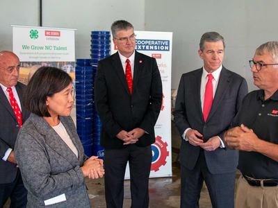 United States trade ambassador Katherine Tai North Carolina governor Roy Cooper visit NC State turkey research Extension facility