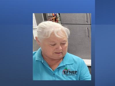 A woman in an EFNEP shirt.