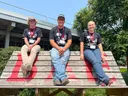4-Hers at NC State pose for a picture on a tall bench