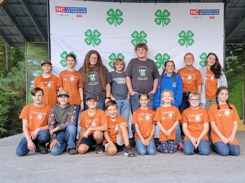club in front of 4-H backdrop