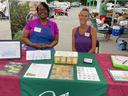 Master Gardener volunteers offer free seed packets at the traveling seed bank at the Mount Holly Farmers Market.