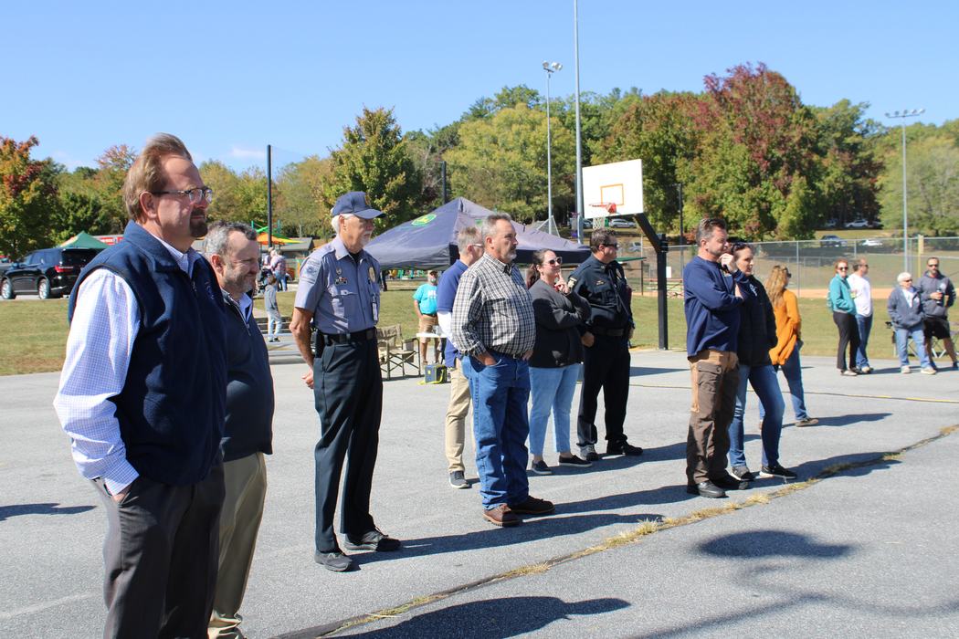 A crowd looks on at an award ceremony.