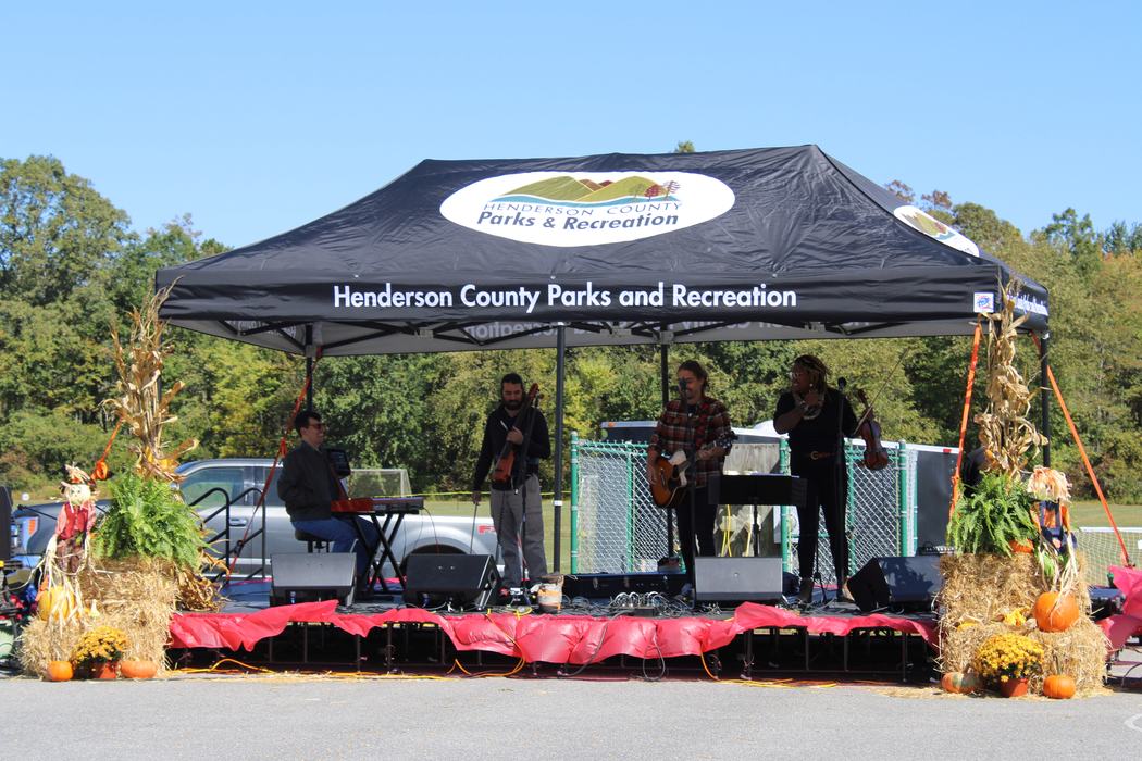 A band plays underneath a tent.