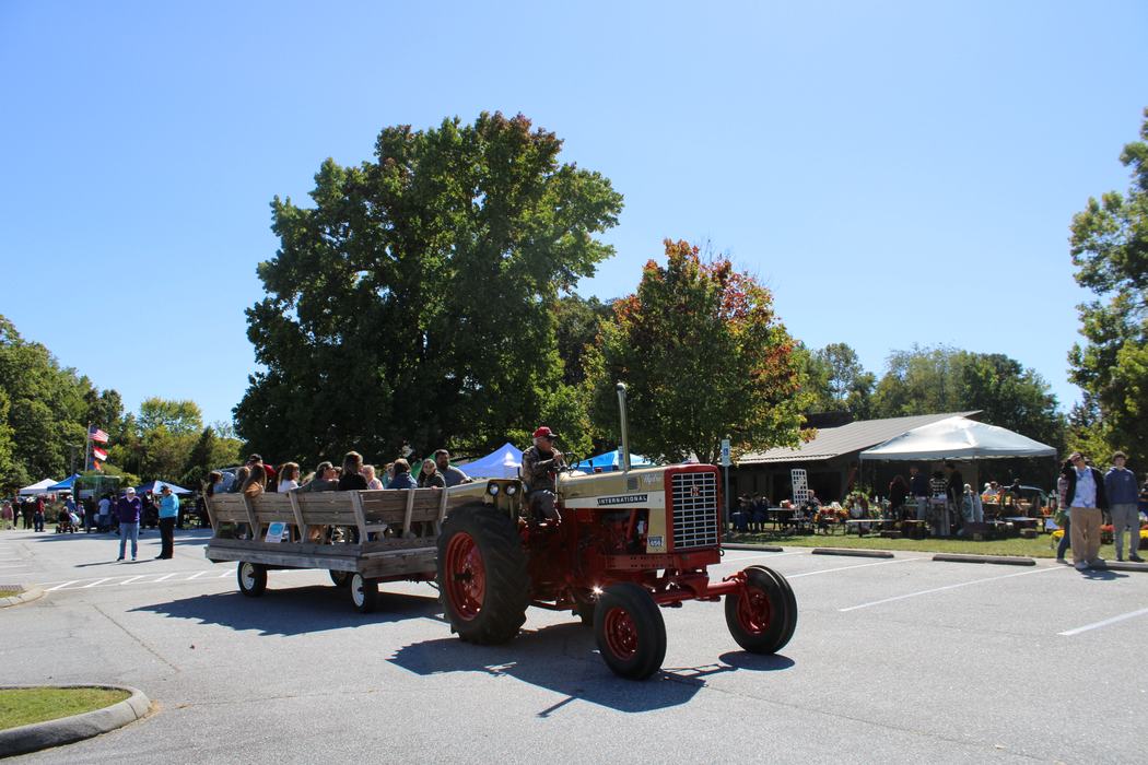 A tractor pulls a hayride.