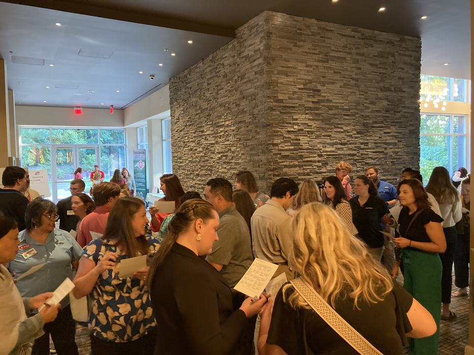 Photo of employees playing human bingo.