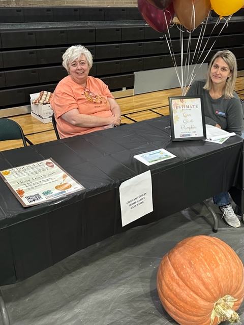 Extension Staff with giant pumpkin