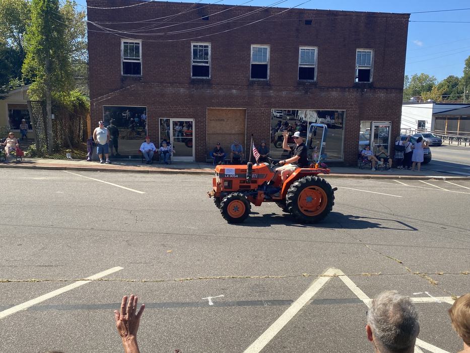 orange tractor in parade