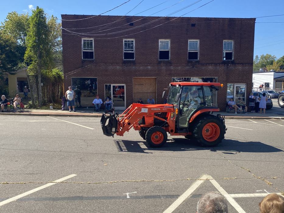 orange tractor in parade