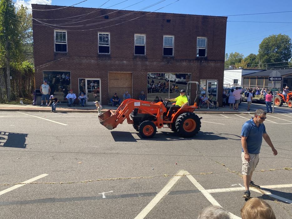 orange tractor in parade